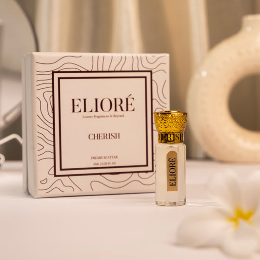 Cherish by Elioré premium attar perfume bottle with luxury packaging in an elegant warm-toned minimal fragrance setup.