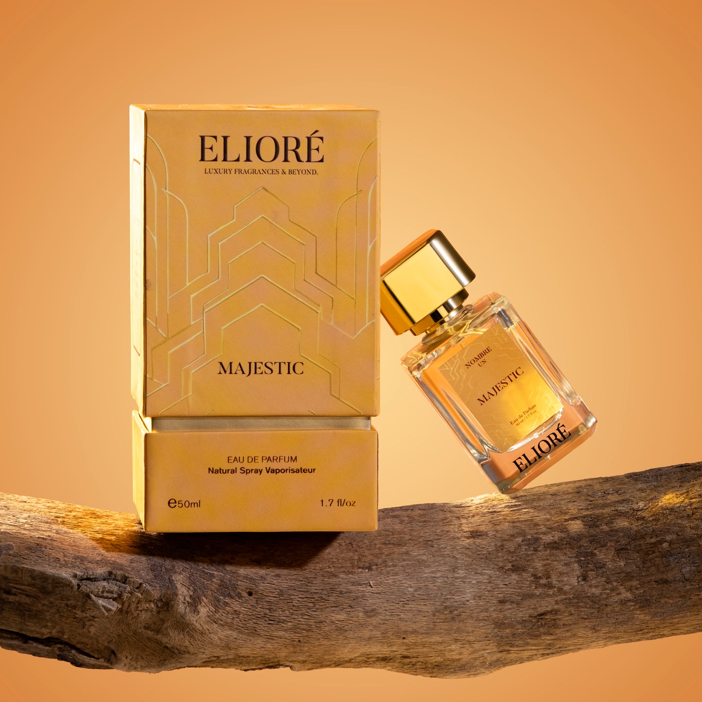 Eliore Majestic perfume bottle and packaging on a wooden surface with a warm background